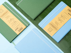 The Canvas Paper Saver Reusable Notebooks made of 100% cotton are available in Sky Blue or Thyme Green.