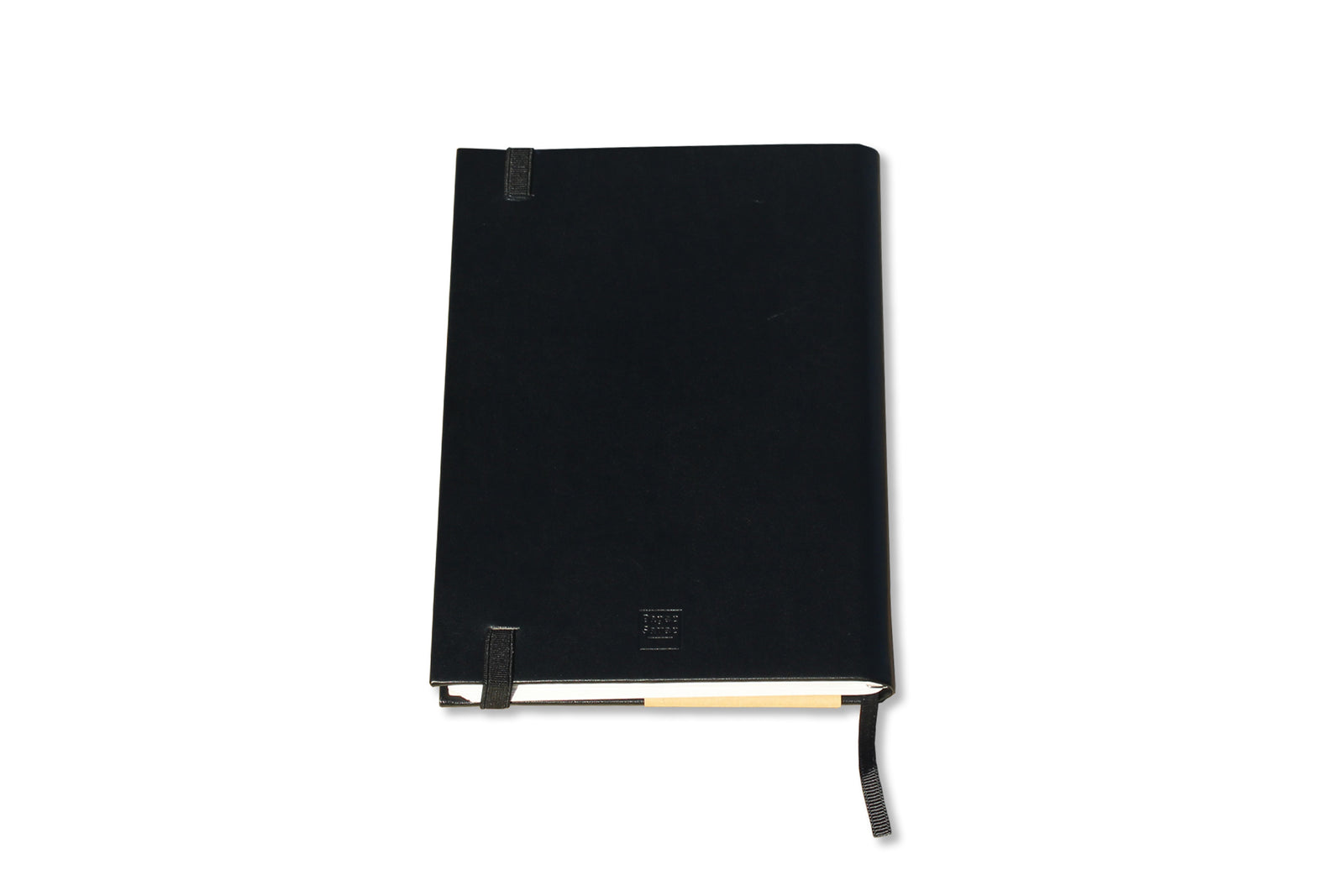The Classic Paper Saver Notebook in black, shown on its back cover, is the only eco-friendly reusable notebook you need to write your notes and ideas while reducing paper waste.  Repurposing your used paper as pages, upcycle your paper to write notes sustainably. Replenish and reuse once done. Write comfortably and sustainably for zero waste living.