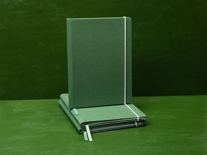 The Canvas Paper Saver Reusable Notebook in Thyme Green is made of 100% cotton