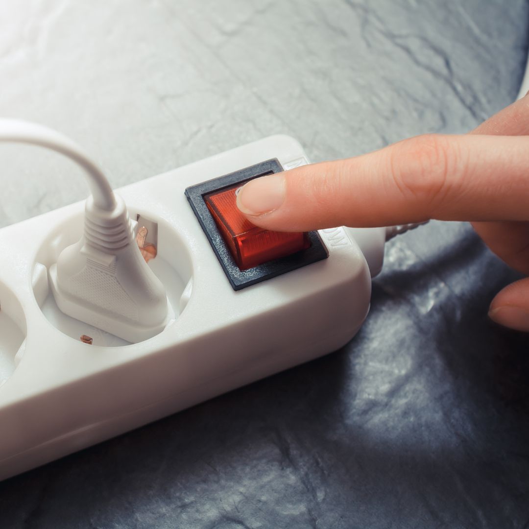 Unplug and power down electronics to reduce energy consumption and environmental impact