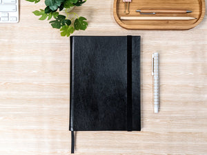 The Classic Paper Saver Notebook in black is the only eco-friendly reusable notebook you need to write your notes and ideas while reducing paper waste.  Repurposing your used paper as pages, upcycle your paper to write notes sustainably. Replenish and reuse once done. Write comfortably and sustainably for zero waste living.
