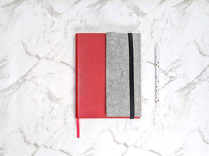 The Classic Paper Saver Reusable Notebook in Berry Red with the Paper Saver Organiser so you can reuse paper easily while staying organised with a pencil case, card and document holders.