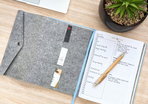 The Canvas Paper Saver Reusable Notebook in Sky Blue with the Paper Saver Organiser so you can reuse paper easily while staying organised with a pencil case, card and document holders.