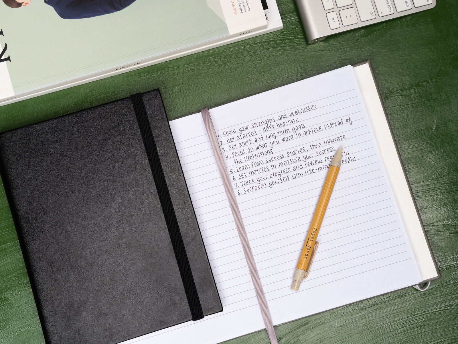 The Paper Saver Reusable Notebook in black reuses scrap paper as pages to help you better reduce waste before recycling.