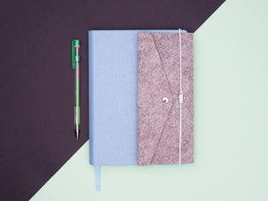 The Sparkle Paper Saver Reusable Notebook in blue with the Paper Saver Organizer for one easy, sustainable, organized carry solution for all your work and office needs.